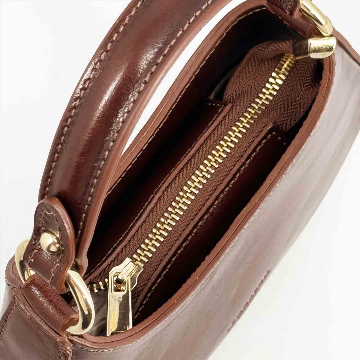 Isotta S - Mini borsa mezzaluna in pelle marrone
